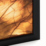 Close-up of textured black wall art featuring colorful leaves on a large framed canvas, ideal for living room decor.