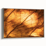Framed canvas featuring close-up of green leaves, ideal for adding a touch of nature to any room.