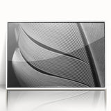 Close-up of leaves in a framed acrylic print, featuring art deco design with green and white tones.