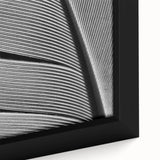 Close-up of textured black wall art featuring colorful leaves on extra large framed canvas, ideal for living room decor.