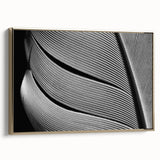 Framed canvas featuring a close-up of leaves in muted green and gold tones, suitable for bedroom wall art.