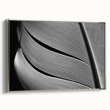 Framed canvas featuring close-up of leaves in vibrant green and yellow tones, ideal for brightening a living room.