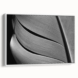 Vintage poster art featuring a close-up of leaves in vibrant green and yellow tones on a white framed canvas.