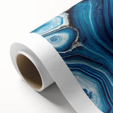 Art deco poster featuring a close-up of natural elements in muted green and brown tones on rolled canvas.