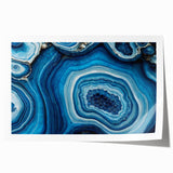 Close-up floral art featuring soft pink and white blossoms on a rolled canvas, ideal for dining room wall decor.