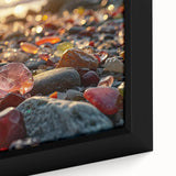 Close-up of textured black wall art featuring colorful natural elements on framed canvas, suitable for living room decor.