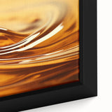 Close-up of textured black wall art featuring colorful natural elements on a large framed canvas.