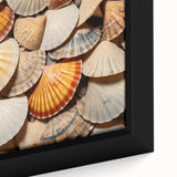 Close-up of textured black wall art featuring colorful natural elements on a large framed canvas.