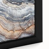 Close-up of black wall art featuring colorful, textured natural elements on a framed canvas, ideal for living room decor.