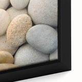 Close-up of black wall art featuring textured, colorful natural elements on a framed canvas, ideal for living room decor.