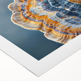 Art deco poster of a stylized floral design in muted gold and cream, printed on rolled canvas.