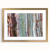 Extra large abstract art print featuring textured natural elements in muted earth tones, framed in gold.