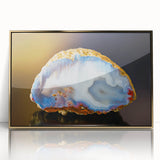 Large art print of natural elements in muted earth tones, framed in gold acrylic, ideal for modern nursery wall decor.