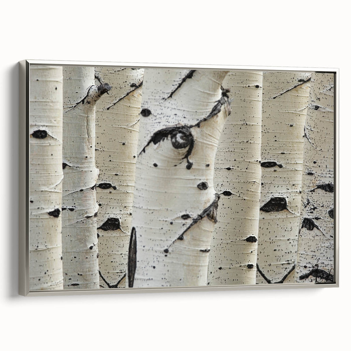 Framed canvas featuring close-up landscape art paintings of trees in muted earth tones, ideal for a contemporary living room.