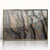 Large art print of a close-up tree design in muted green and brown, framed in gold acrylic.