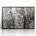 Large abstract wall art featuring close-up tree designs in black and white tones, framed in acrylic.