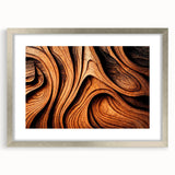 Textured abstract art print featuring close-up tree designs in muted green and brown, framed in silver.