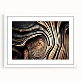 Abstract art print featuring close-up of trees in muted green and brown tones, framed in white.