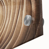 Large abstract wall art on acrylic glass featuring close-up of trees in muted earth tones, ideal for dining room decor.