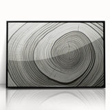 Large abstract wall art featuring close-up tree designs in black and white, framed in acrylic.