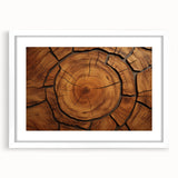 Abstract art print of close-up tree designs in muted green and brown tones on a white framed canvas.