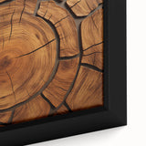 Close-up black wall art featuring a textured tree design on a framed canvas with colorful accents.