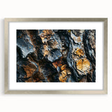 Textured art print of abstract tree close-ups in gray and silver tones, framed in silver, suitable for bedroom decor.