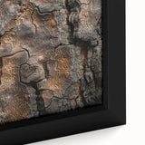 Close-up of black wall art featuring a textured tree design on a framed canvas, with vibrant, colorful accents.