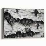 Framed canvas featuring a close-up of tree textures in black and silver.