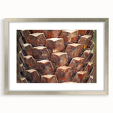 Textured art print of abstract tree close-ups in muted earth tones, framed in silver, ideal for bedroom wall decor.