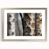 Textured art print of abstract tree close-ups in muted green and brown tones, framed in silver, suitable for bedroom decor.