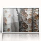 Acrylic print of close-up tree designs in muted greens and browns, framed in white, suitable for modern nursery decor.