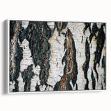 Framed canvas featuring a close-up view of tree trunks in a forest, using a palette of black and earth tones.