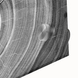 Large abstract wall art featuring close-up of trees in muted green and brown tones on acrylic glass.