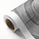 Art deco poster featuring close-up of tree branches on rolled canvas, with muted earth tones, ideal for nursery wall art.