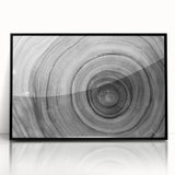 Large abstract wall art featuring close-up tree designs in black and white, framed in acrylic.