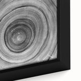 Extra large framed canvas featuring a close-up of trees with a black and colorful textured art design.