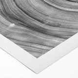 Art deco poster featuring a close-up of tree designs in muted green and brown on rolled canvas.