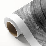 Art deco poster featuring a close-up of tree branches on rolled canvas, with muted green and brown tones.