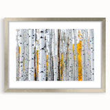 Textured art print of abstract trees in muted green and brown, silver-framed with mat, suitable for bedroom decor.