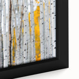 Close-up of a black textured tree design on a large framed canvas, with vibrant color accents, ideal for living room decor.