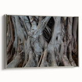 Framed canvas depicting a close-up view of trees in a landscape art painting, featuring a silver frame.