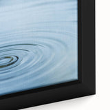 Close-up of black textured art featuring vibrant water design on framed canvas, ideal for living room decor.