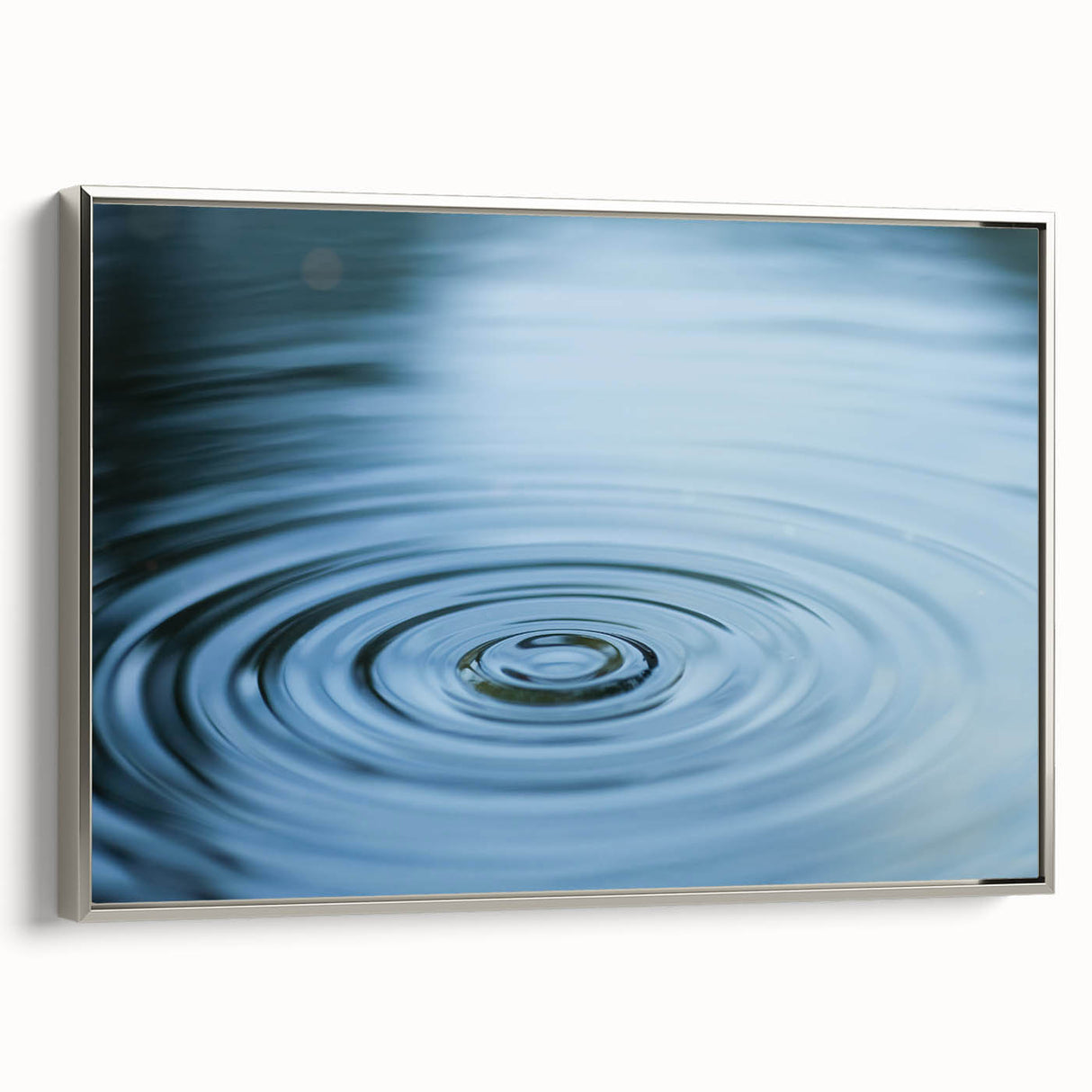 Framed canvas depicting a close-up of water in nature, with vibrant blue and silver tones.