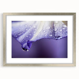 Textured art print featuring abstract ripples in blue and gray tones, framed in silver, ideal for bedroom art.