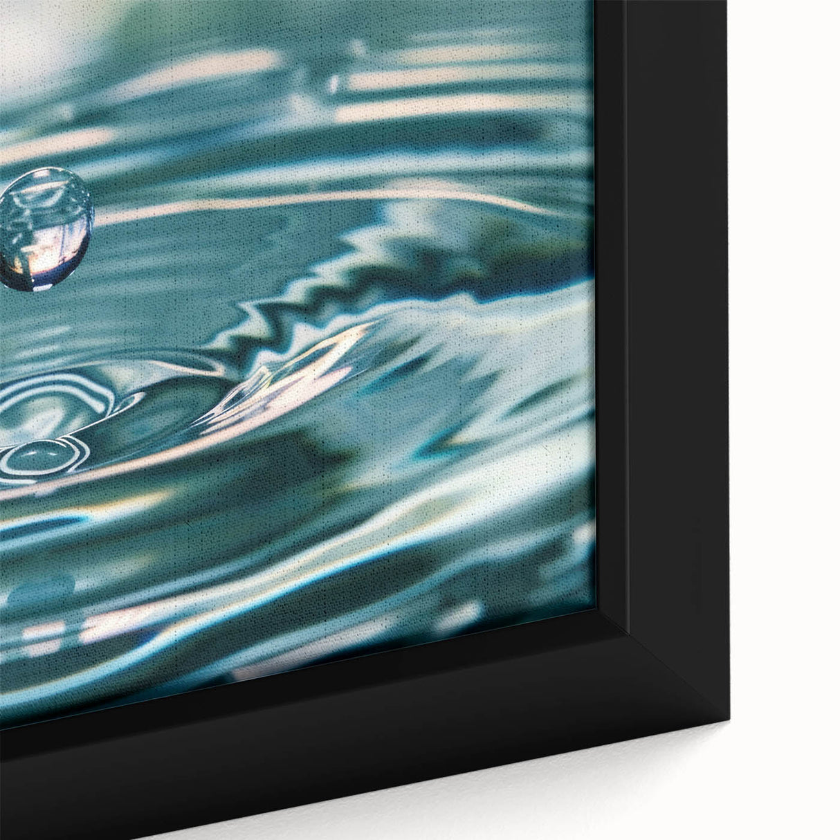 Close-up of a black framed canvas depicting a textured, colorful water design, ideal for living room decor.