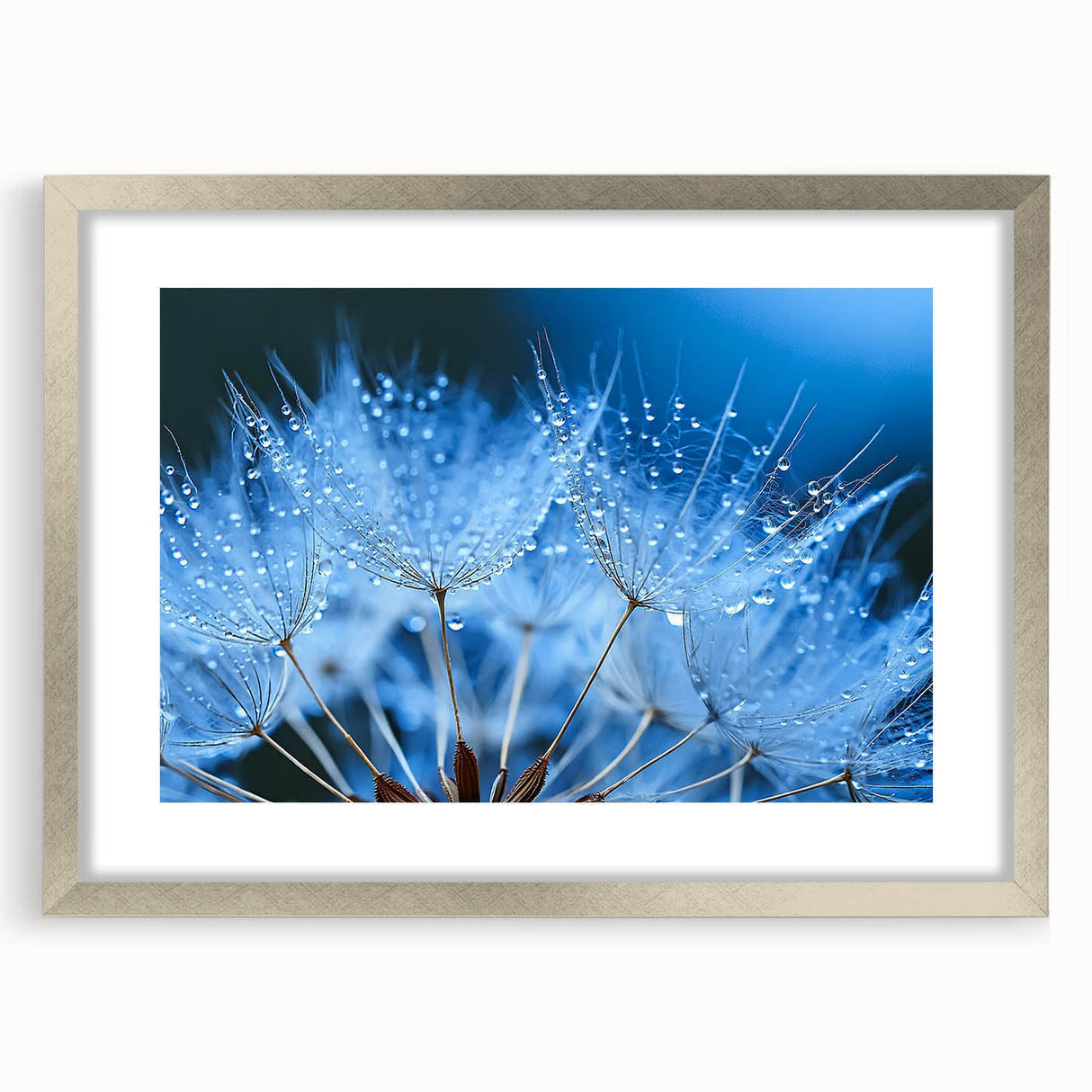 Textured abstract art print featuring swirling blue and gray patterns, framed in silver, ideal for bedroom decor.