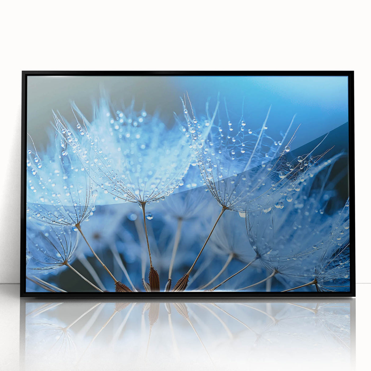 Large abstract wall art of water ripples in muted blue and gray tones, framed in black acrylic.