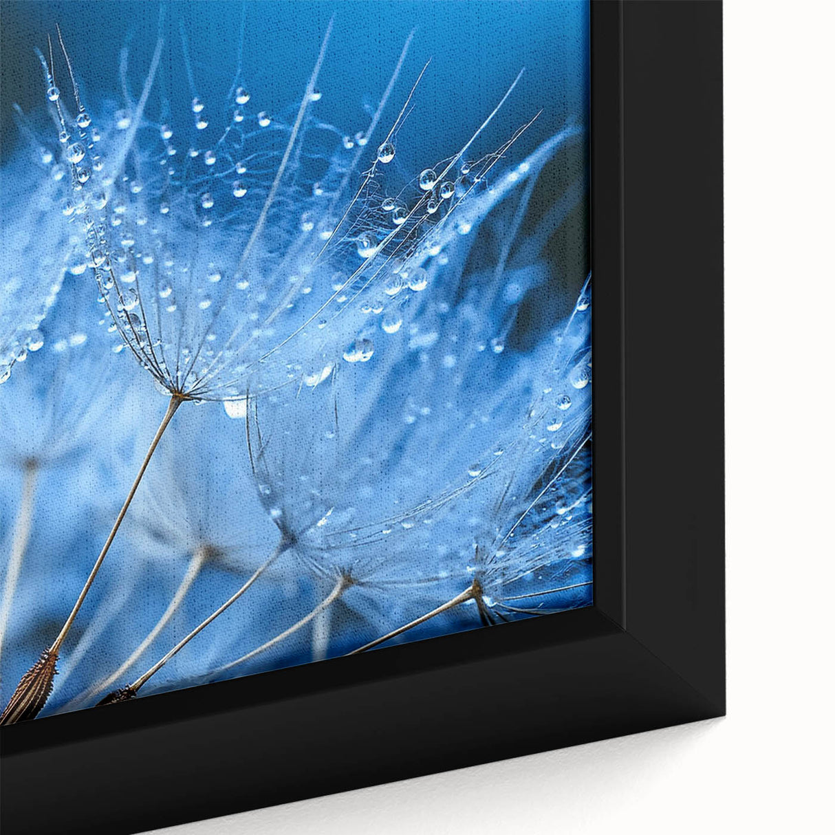 Close-up of textured black wall art featuring vibrant water-inspired designs on framed canvas.