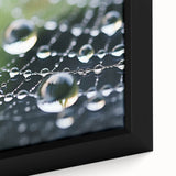 Close-up of black wall art featuring a colorful, textured water design on a framed canvas, ideal for living room decor.